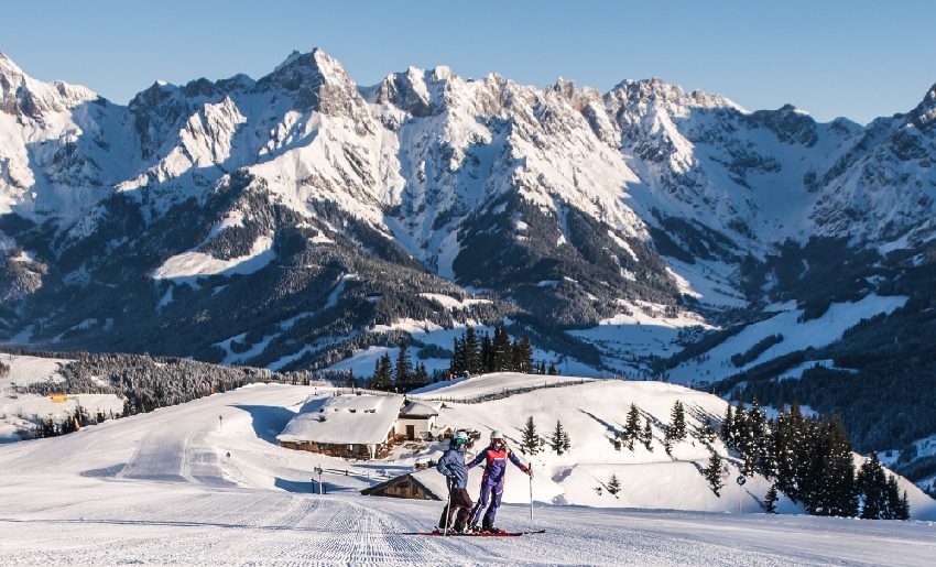 2 People Skiing Down Mountain